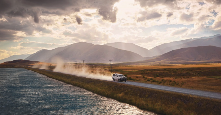 Hero image for news page car driving along road